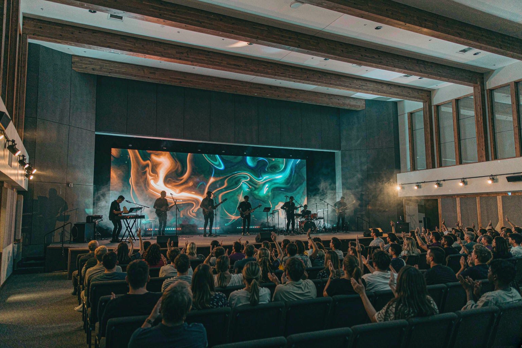 Modern church sanctuary with a large seamless church LED wall behind the worship band during Sunday service