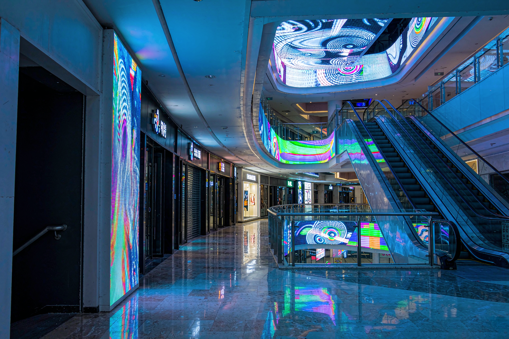 Shopping mall micro LED screens still running continuously after closing hours, illustrating 100,000-hour lifespan